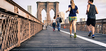 People Running on Bridge