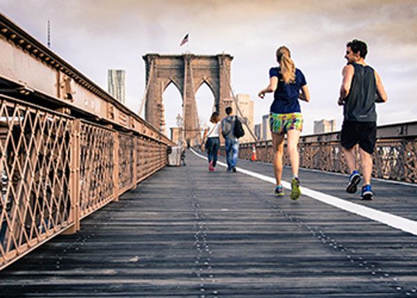 People Running on Bridge